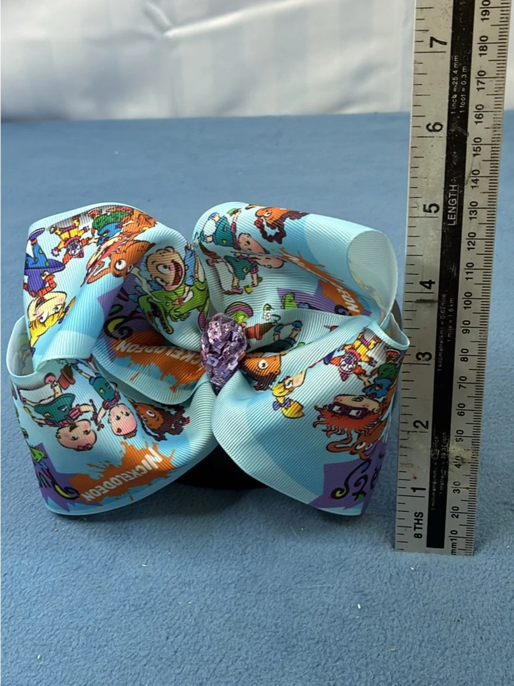 Nickelodeon Rugrats Print Light Blue Hair Bow with Purple Gem